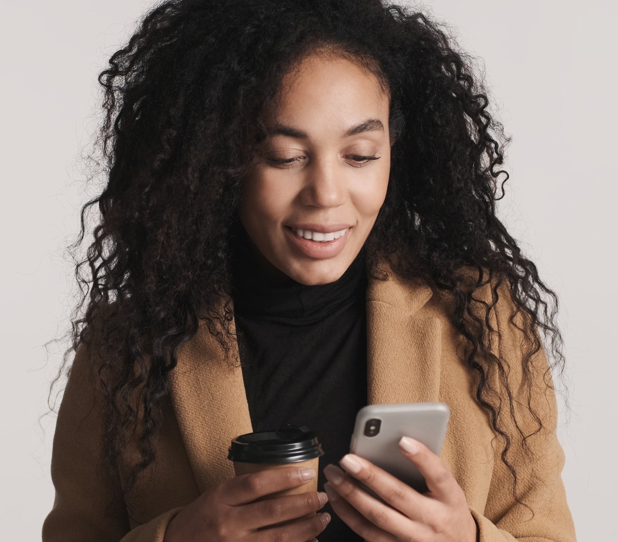 beautiful-african-american-woman-using-smartphone-2024-10-21-15-38-49-utc